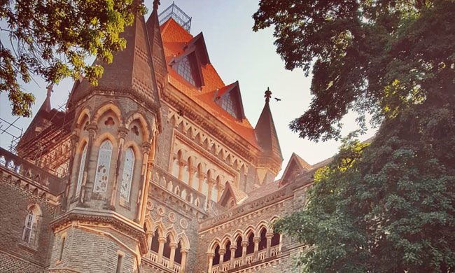 Act Of Touching A Colleague’s Hand Does Not Constitute The Offence Of Outraging Modesty Of A Woman: Bombay HC [Read Judgment]